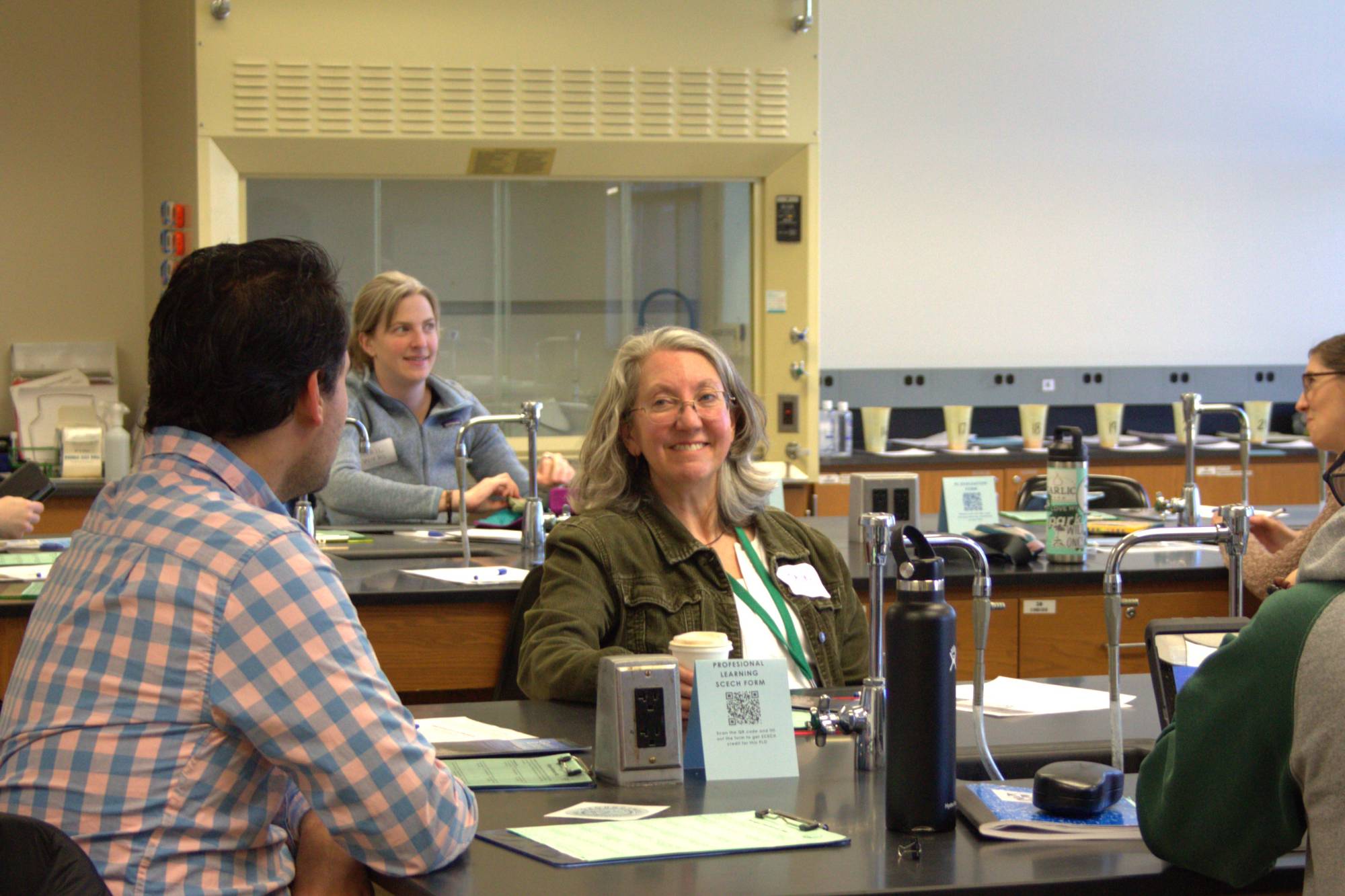 Educator smiling at a professional learning opportunity